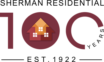 an illustration of a house with the word shearman residential written in a circle around it
